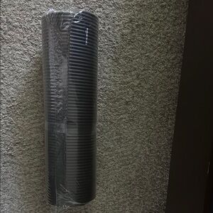 Black yoga or fitness mat REEBOK with strap